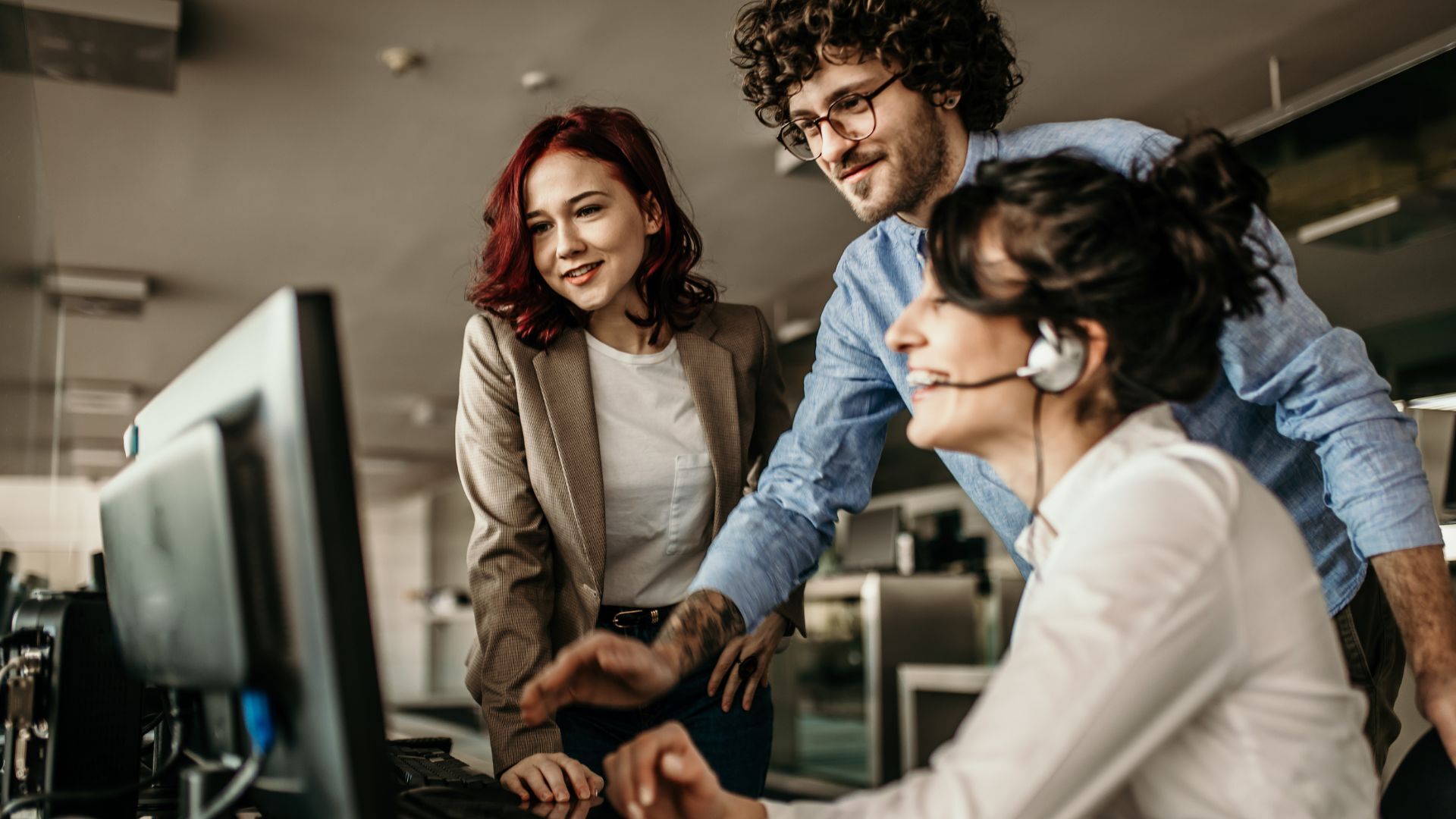 image of coworkers at a computer